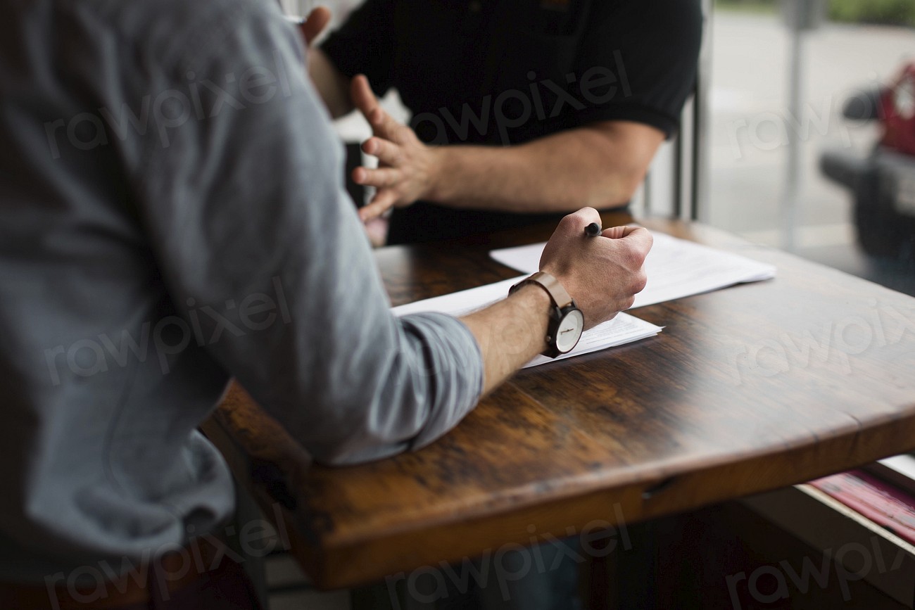 Private investigator interviewing a witness